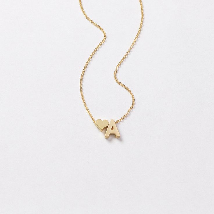 Dainty ♥ initial necklace - a meaningful piece of jewelry that is simple and stylish. D E T A I L S * Single initial size is approximately 5 x 7 mm * Chain is 14k gold fill, sterling silver, or 14k rose gold fill OR 14k gold plate, silver plate, or 14k rose gold plate * Charms are matte gold plate, matte silver plate, or shiny rose gold plate * This listing is for one necklace with two charms P R O M O T I O N * Bridesmaids gifts: message us for a coupon code * New FACEBOOK or INSTAGRAM follower Valentine's Day Initial Pendant Necklace With Adjustable Chain, Heart Initial Pendant Necklace With Adjustable Chain For Gift, Gift Heart Necklace With Initial Pendant And Adjustable Chain, Mother's Day Heart Necklace With Adjustable Initial Pendant, Minimalist Heart Necklace With Initials For Personalized Gift, Valentine's Day Initial Pendant Necklace With Delicate Chain, Rose Gold Initial Pendant Necklace For Valentine's Day, Gold Initial Letter Necklace For Valentine's Day, Delicate Chain Initial Pendant Necklace For Valentine's Day