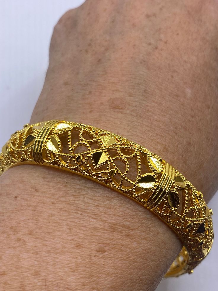 Vintage Bangle Bracelet Golden Bronze filigree  22k over bronze Indian wedding bangle  Fits a small to average wrist    All jewelry is shipped free in the US in a nice gift box.   Check out our over a THOUSAND great reviews Engraving is $4 per letter and is not always perfect depending on the piece. It can take a few days if the jeweler is busy. This is payable to Paypal Judithsltd@gmail.com Vintage Bangle Bracelets, Vintage Bangles, Gmail Com, Bangle Bracelet, Arm Band, Indian Wedding, Bangle Bracelets, Jewelry Bracelets, Vintage Items