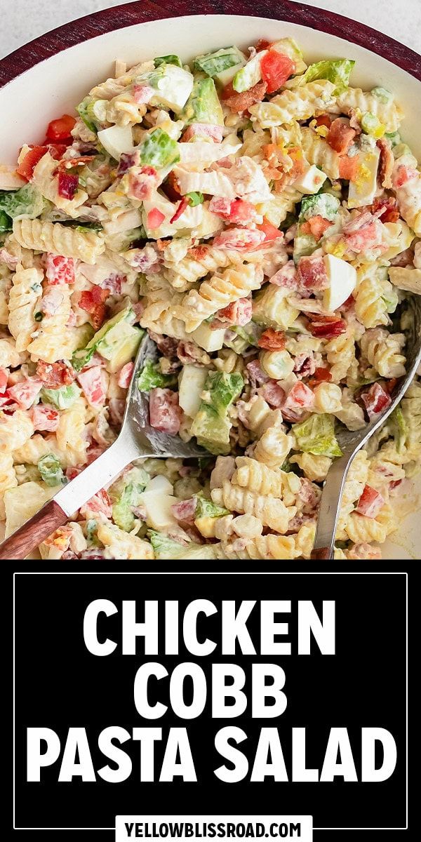 chicken cobb pasta salad in a white bowl with a serving spoon and title overlay