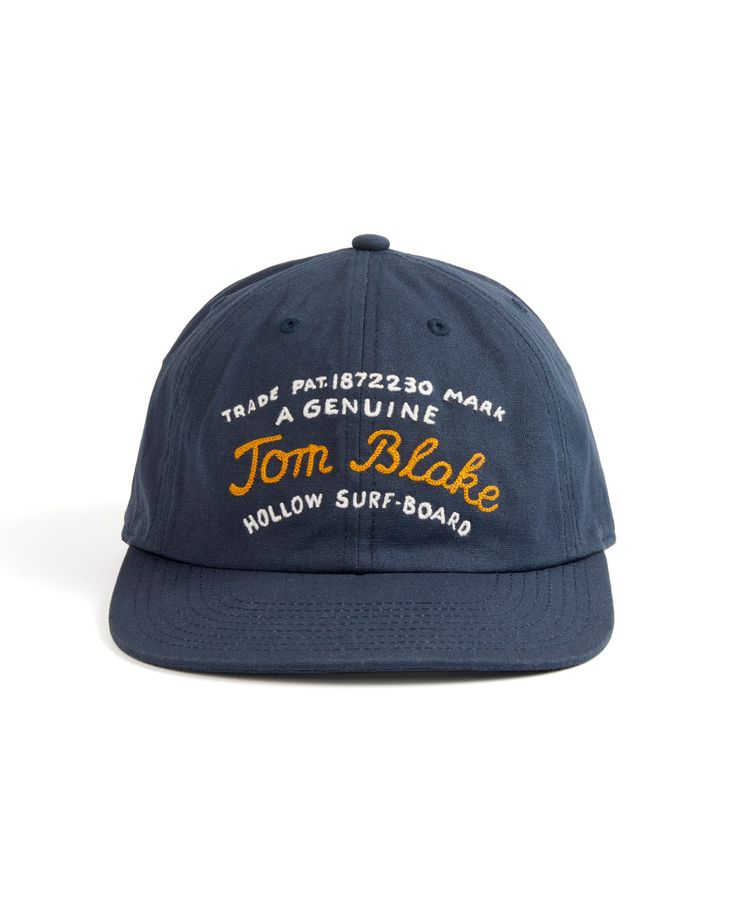 This hat graphic was inspired by Tom Blake's patented trademark for the construction plans of his original design for the Hollow Surfboard from 1926. Camp Hat, Hat Accessories, The Hollow, Harp, Clean Design, Dark Navy, Surfboard, Original Design, Clothing Brand