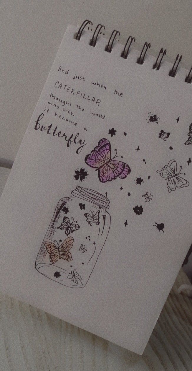 a notepad with a jar and butterflies on it