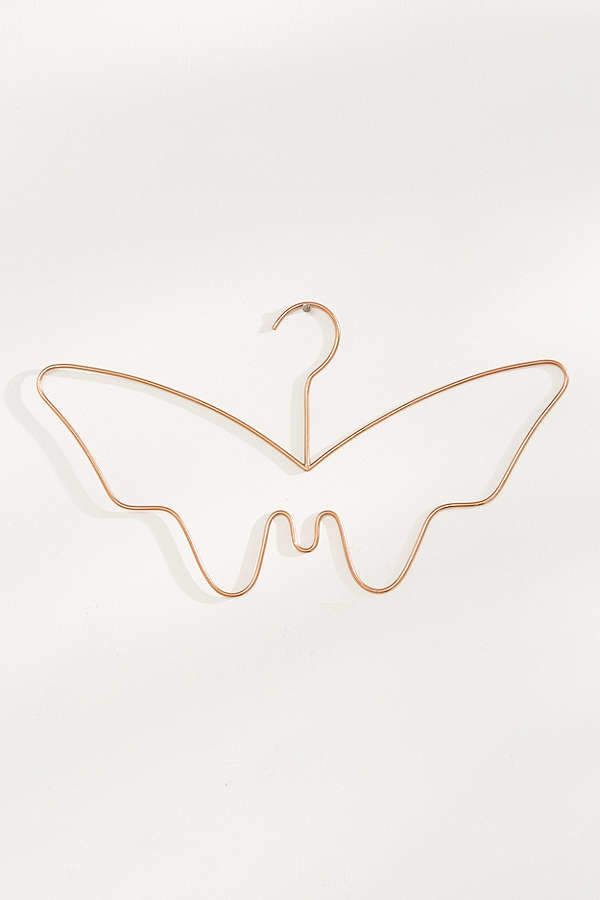 a metal hanger shaped like a butterfly