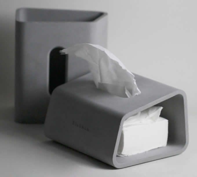 a tissue dispenser sitting on top of a counter