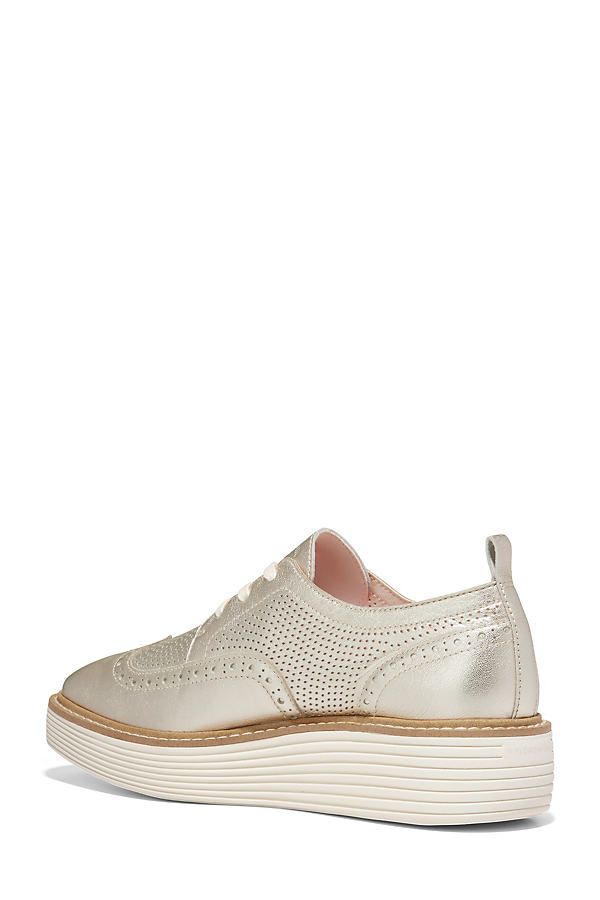 Leather upper, insole Rubber sole Slip-on styling Imported | Original Grand Platform Oxfords by Cole Haan in Gold, Women's, Size: 5, Leather/Rubber at Anthropologie Spring Oxfords With Branded Insole And Round Toe, Elegant Wingtip Sneakers With Removable Insole, Spring Oxfords With Removable Insole And Round Toe, Spring Low-top Oxfords With Perforated Toe Box, Spring Slip-on Sneakers With Brogue Detailing, Elegant Synthetic Sneakers With Textured Sole, Formal Leather Sneakers For Summer, Elegant Low-top Lace-up Shoes With Perforated Toe Box, Elegant Slip-on Sneakers With Round Toe