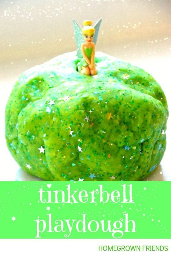 a tinkerbell playdough with green sprinkles and a fairy on top