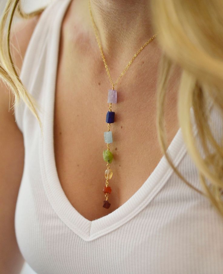 Raw Crystal Chakra Necklace - Sterling Silver or 14k Gold Filled It's said that wearing Chakra colors helps maintain the Chakras at their right energy level, making the wearer feel more balanced. This long pendant features the seven major chakras with raw, genuine crystals. Each stone is natural, therefore they are all slightly different in shape, color, and size.  The pendant length averages 4 inches (11 cm).   The stones included are: - Red: Garnet - Root Chakra - Orange: Carnelian - Sacral Ch Pride Necklace, Garnet Heart, Crystal Chakra, Seven Chakra, Chakra Colors, Chakra Racine, Orange Carnelian, Gold Heart Ring, Raw Crystal Jewelry