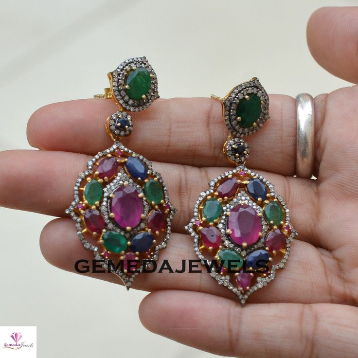 Ruby Gemstone Earrings, Emerald Silver Earrings, Pave Diamond Earrings, Sapphire Gemstone Jewelry, 925 Silver Gold Plated Jewelry, Gifts Gross Weight: 16.32 gram Gemstone Weight: 16.87 cts Diamond Weight: 1.90 cts Earrings Size: 54X26 MM NOTE:- All The Products Are Designed And Manufactured In My Workshop By Me & My Team. Shown Products Are Purely Handmade. Custom Orders Are Open Handly Accepted. We Are the Perfect Choice For Any Custom Jewelry Manufacturing. For Bulk Orders Please Message m Multicolor Diamond Round Earrings, Multicolor Round Diamond Earrings, Multicolor Diamond Gemstone Earrings, Diamond Multi-stone Earrings For Anniversary, Diamond Multi-stone Earrings For Gift, Round Multi-stone Earrings For Anniversary, Fine Jewelry Multi-stone Diamond Earrings For Gift, Fine Jewelry Multi-stone Earrings For Anniversary, Multi-stone Cubic Zirconia Round Earrings