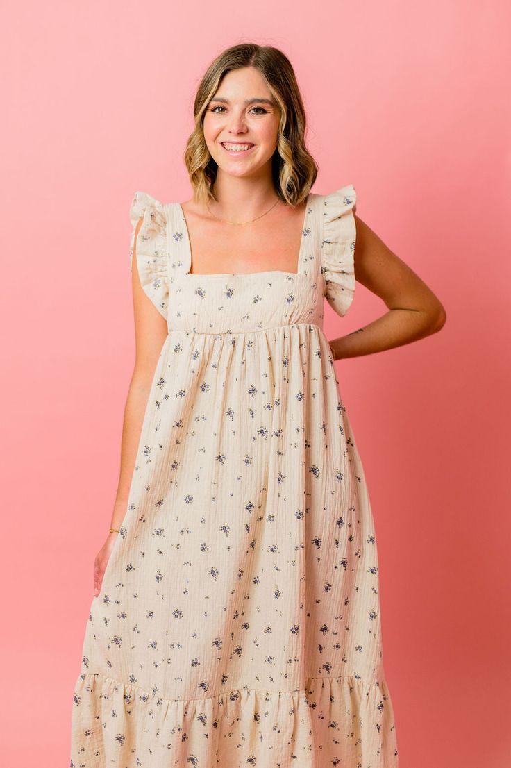 Ivory and Taupe floral midi, makes for the most lightweight contemporary summer Dress. Featuring a puff sleeve, square neckline, smocking, and open tie back. FABRIC: 100% Cotton SIZING: true to to size, model is wearing size small Square Neck Ditsy Floral Dress For Day Out, Floral Print Sundress With Straight Neckline For Brunch, Spring Midi Dress With Smocked Bodice, Spring Midi Dress With Smocked Bodice And Straight Neckline, Square Neck Floral Midi Dress For Daywear, Beige Square Neck Sundress For Day Out, Chic Floral Square Neck Dress For Brunch, Summer Floral Print Midi Dress With Flutter Sleeve, Summer Ditsy Floral Print Dress With Square Neck