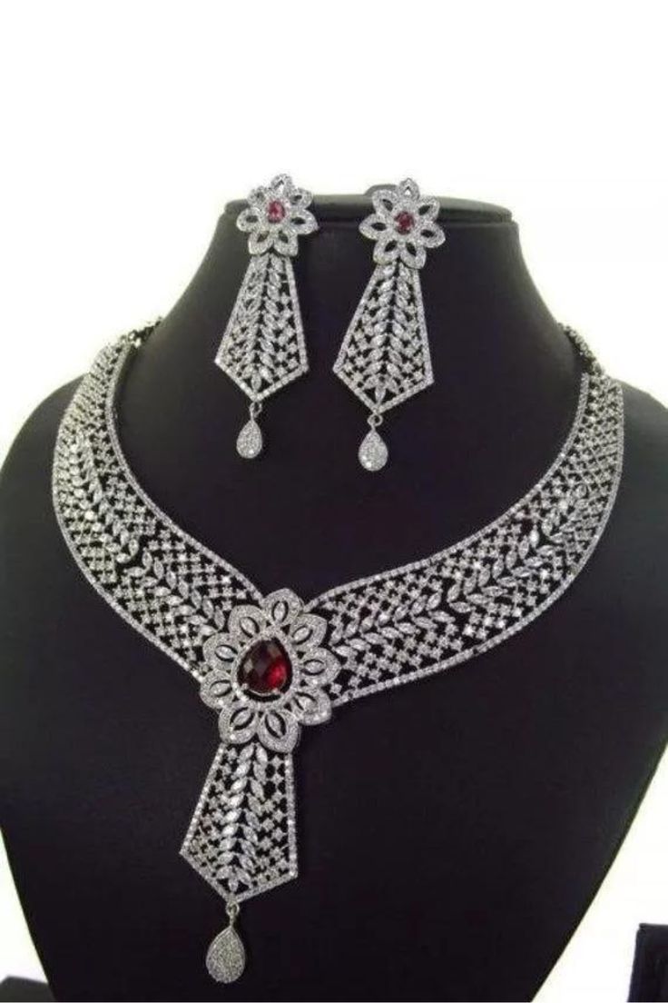 Elegant Red Bridal Sets For Formal Occasions, Wedding Silver Diamond Necklace With Intricate Design, Red Sterling Silver Bridal Necklace For Wedding, Elegant Jewelry Sets With Intricate Design And Cubic Zirconia, Exquisite Silver Jewelry Sets With Intricate Design, Classic Diamond Necklace For Wedding With Intricate Design, Elegant Bridal Necklace With Intricate Cubic Zirconia Design, Elegant American Diamond Necklace With Intricate Design, Formal Crystal Jewelry Set With Intricate Design