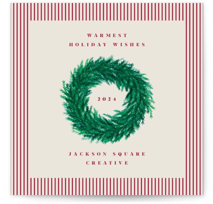 a holiday card with a wreath on it