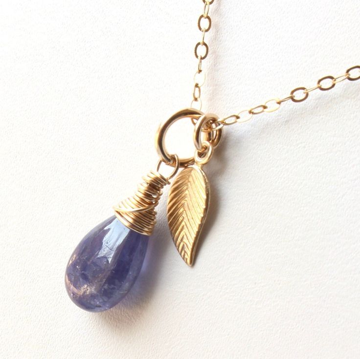 5983 Tanzanite Pendant or Necklace Gold Filled wire wrapped natural violet blue gemstone leaf charm minimalist dainty solitaire choker mothers day birthday anniversary or holiday gift for her women mom sister wife girlfriend niece aunt grandma cousin best friend colleague. Enjoy the beauty & power of natural gemstones - find TANZANITE healing properties below. THIS LISTING IS FOR THE NECKLACE ONLY Earrings shown for illustration and listed separately MATERIALS & DIMENSIONS ✦ Natural TANZANITE, v Tanzanite Teardrop Gemstone Jewelry, Teardrop Tanzanite Gemstone Jewelry, Wire Wrapped Round Pendant Jewelry As Gift, Dainty Everyday Pendant Jewelry, Fine Jewelry Sapphire Teardrop Pendant, Tanzanite Briolette Necklace Gift, Sapphire Teardrop Pendant Fine Jewelry, Briolette Tanzanite Necklace For Gift, Handmade Fine Jewelry With Round Pendant