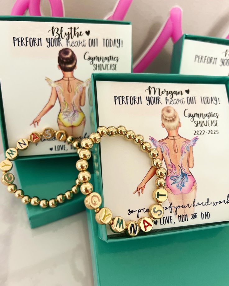 This Gymnastics beaded Bracelet & card set is the ideal gift to commemorate a special gymnastics performance. Featuring a gold beaded bracelet with the word "gymnast", the included card can be personalized with a choice of leotard color, hair, and skin tone. You can also enter your own text, making the card an unforgettable memento. With your purchase you receive: 1 "Gymnast" gold beaded bracelet (fit for young children through small adjust wrists) 1 Personalized card with text and custom Gymnas Customized Gold Beaded Bracelets For Birthday Gift, Customizable Gold Beaded Bracelet For Birthday, Personalized Gold Beaded Bracelet For Birthday, Gold Bracelets With Letter Beads For Birthday Gift, Flexible Hypoallergenic Stretch Bracelet As A Gift, Flexible Hypoallergenic Beaded Bracelets For Gifts, Customizable Gold Stretch Bracelet For Birthday, Customized Gold Stretch Bracelet For Birthday, Flexible Personalized Bracelets As Gifts