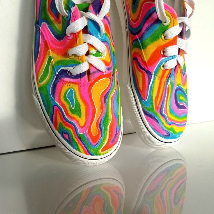 Custom hand painted Funky Festival Rainbow shoes. These colorful rainbow sneakers will be perfect for rave and disco music festival. Acrylic paint on canvas shoes. Every size is possible. I use US size chart!  Shoes are hand painted using High grade acrylic paint. I use a special textile paint designed to be flexible on fabric. The paint is water proof and fade proof.  Prices depends on what model of shoes you will choose LET ME KNOW IF YOU NEED YOUR ORDER ASAP OR FOR A SPECIFIC DATE  SIZE Pleas Festival Shoes Comfortable, Colorful Fun Sneakers For Summer, Fun Multicolor Hand Painted Sneakers, Hand Painted Multicolor Fun Sneakers, Fun Multicolor Low-top Canvas Shoes, Artsy Hand Painted Multicolor Sneakers, Fun Rainbow Sneakers For Spring, Artistic Multicolor Spring Sneakers, Artistic Multicolor Sneakers For Summer