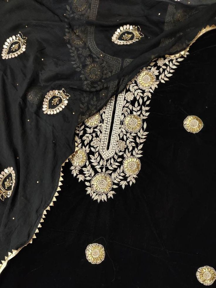 Item Overview ATHARVA Hand Embroidery Salwar Kameez Velvet/Gota Pati Dori Dabka Work/Black/Velvet Heavy Chiffon Dupatta/Custom Stitch Unstitch/Gift Dno. VL029 Fabric: * Shirt - Velvet 2.5 Mts - Hand Embroidered Neck & All Over * Dupatta: Embroidered Chiffon Chinnon Dupatta- All over Gota Patti & Dori Dabka Work Embroidery bootis- 2.5 Mts- Latkans Tassels - * Bottom - Plazzo Velvet 2.5 Mts. Excusive Hand Embroidered Party Wear Punjabi Suit. 🌷CUSTOMIZATION (No Extra Charges) * Fabrics Customizati Black Sharara With Chikankari Embroidery For Diwali, Unstitched Black Chanderi Embroidered Fabric, Traditional Black Semi-stitched Unstitched Suit, Black Traditional Semi-stitched Unstitched Suit, Black Unstitched Suit With Zari Work For Navratri, Traditional Velvet Wear With Zari Work, Festive Black Unstitched Suit With Chikankari Embroidery, Semi-stitched Black Unstitched Suit With Chikankari Embroidery, Black Unstitched Suit With Chikankari Embroidery For Festive