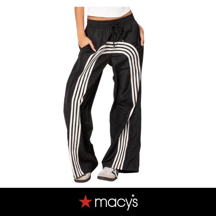 in stock Sporty Summer Parachute Pants For Streetwear, Sporty Streetwear Bottoms For Spring, Sporty Parachute Pants For Summer Streetwear, Black Pants With Side Stripes For Spring, Sporty Leisure Pants For Spring, Sporty Parachute Pants For Summer Sports, Cotton Three Stripes Joggers For Spring, Spring Athleisure Pants With Contrast Stripes, Contrast Stripes Bottoms For Streetwear In Spring