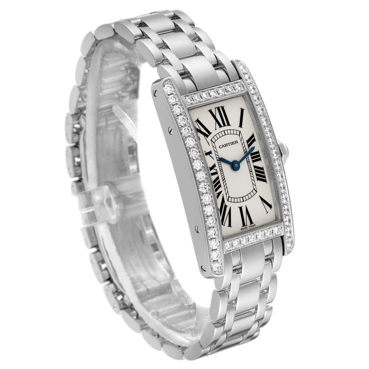 Cartier Tank Americaine White Gold Diamond Ladies Watch WB7073L1. Quartz movement. 18K white gold case 19.0 x 35.0 mm. Octagonal crown set with original Cartier factory faceted diamond. . Scratch resistant sapphire crystal. Silvered grained dial with black Roman numeral hour markers and an inner minute track. Sword-shaped blued steel hands. 18K white gold bracelet with hidden butterfly clasp. Fits a 6" wrist. Cartier Diamond Watch With Round Dial, Cartier Diamond Watch With Diamond Accents, Classic Diamond White Watch With Brilliant Cut, Classic Platinum Diamond Watch With Brilliant Cut, Classic Wedding Jewelry And Watches With Diamond Hour Markers, Cartier Diamond Watch With Brilliant Cut, Luxury Cartier Diamond Watch For Anniversary, Formal Diamond Jewelry With Vvs Clarity, Luxury Cartier Diamond Watch With Diamond Accents