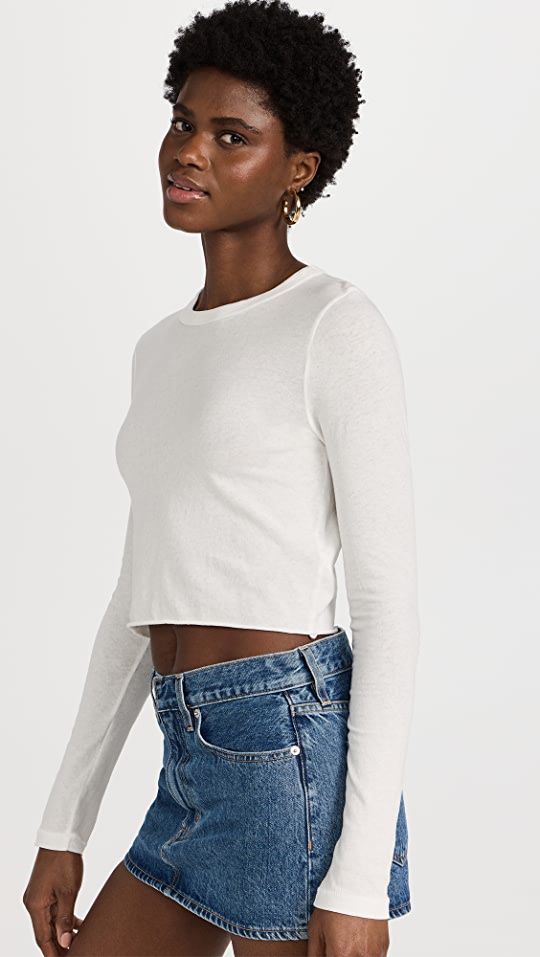 SLVRLAKE Long Sleeve Crop Baby Tee | SHOPBOP Basic Long Sleeve Tops With Thumbholes, Crew Neck Long Sleeve Cotton Top With Thumbholes, Cotton Long Sleeve Crew Neck Top With Thumbholes, Cotton Long Sleeve Top With Thumbholes And Crew Neck, Long Sleeve Cotton Tops With Thumbholes, Cotton Long Sleeve Tops With Thumbholes, White Long Sleeve Top With Thumbholes For Spring, Spring Crew Neck Long Sleeve Top With Thumbholes, Fitted White Cotton Long Sleeve Top