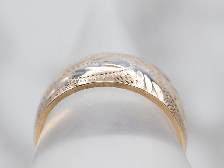 So many wonderful details come together to give this vintage band a rich, textural feel! Crafted of 14 karat yellow gold, this is a great band for stacking or wearing traditional as a wedding band!Metal: 14K Yellow GoldWidth of Band: 8.0 mmHeight off Finger: 1.4 mmRing Size: 6Marks: “<14K>” Stamped on the inside band Heirloom Style Gold Stackable Rings, Heirloom Yellow Gold Stackable Rings, Gold Stackable Rings With Decorative Band, Heirloom 14k Gold Ring With Decorative Band, Yellow Gold Wedding Band With Decorative Detail, Yellow Gold Wedding Ring With Decorative Band, Heirloom Ring With Decorative Band In 14k Gold, Traditional Etched Yellow Gold Engraved Ring, Traditional Yellow Gold Engraved Ring