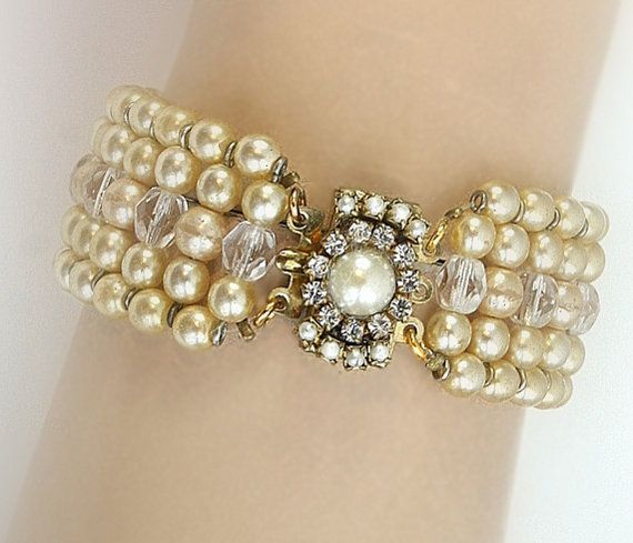 Beautiful bridal pearls bracelet features ivory cream Swarovski pearls and AB clear crystals in combination with hand decorated silver clasp set Wedding Pearl White Beaded Bracelets, Vintage Pearl Bracelet For Formal Occasions, Adjustable Pearl Wedding Bracelet, Pearl Drop Bracelet For Wedding, Wedding Bracelet With Pearl Drop, Pearl Chain Bracelet For Wedding, Adjustable Pearl Embellished Bracelet For Wedding, Adjustable Pearl Drop Bracelet For Weddings, Wedding Pearl Chain Bracelet