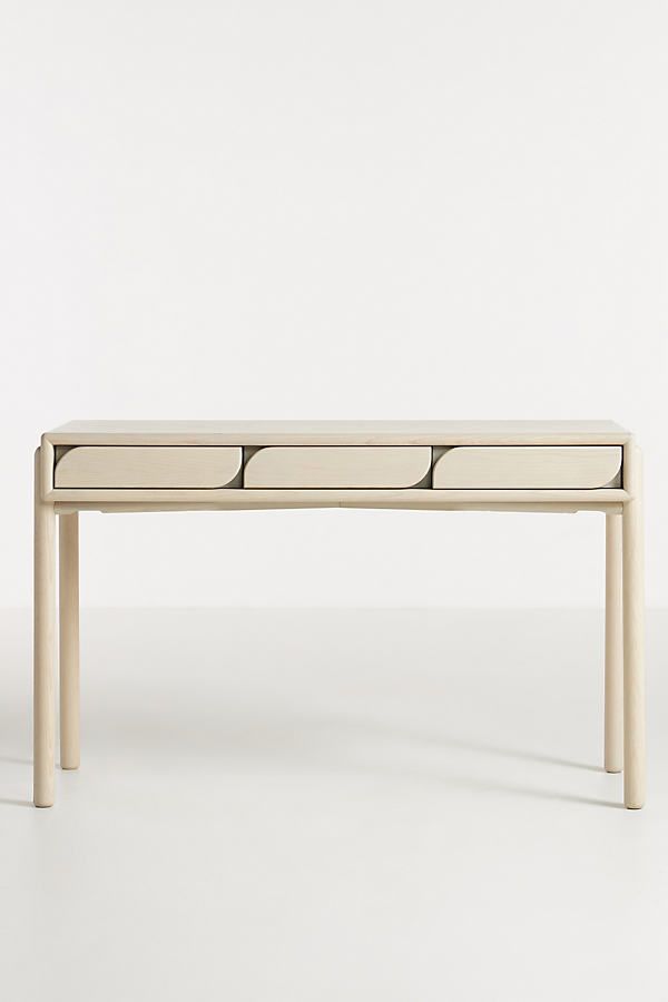 a white table with four drawers on it