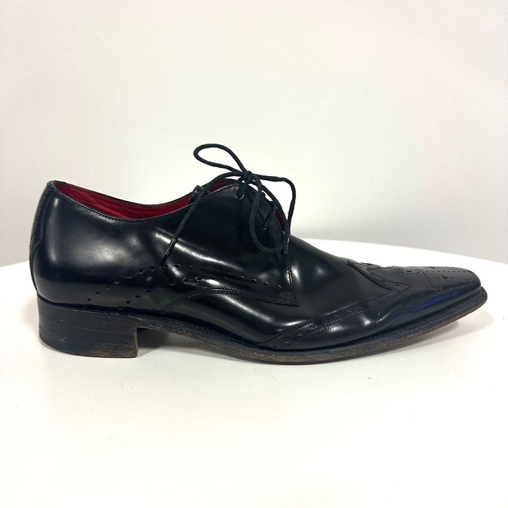 Designer: Jeffrey West Size: 10 Made In England Black Leather Lace Up Wingtips Pre-Owned Great Condition, Like New. Black Pointed Toe Formal Lace-up Shoes, Classic Pointed Toe Lace-up Calf Leather Shoes, Classic Pointed Toe Calf Leather Lace-up Shoes, Black Wingtip Lace-up Shoes For Formal Occasions, Pointed Toe Calf Leather Lace-up Shoes For Derby, Black Pointed Toe Dress Shoes With Rubber Sole, Pointed Toe Calf Leather Lace-up Shoes, Calf Leather Lace-up Shoes With Pointed Toe For Derby, Calf Leather Pointed Toe Oxfords With Brogue Detailing