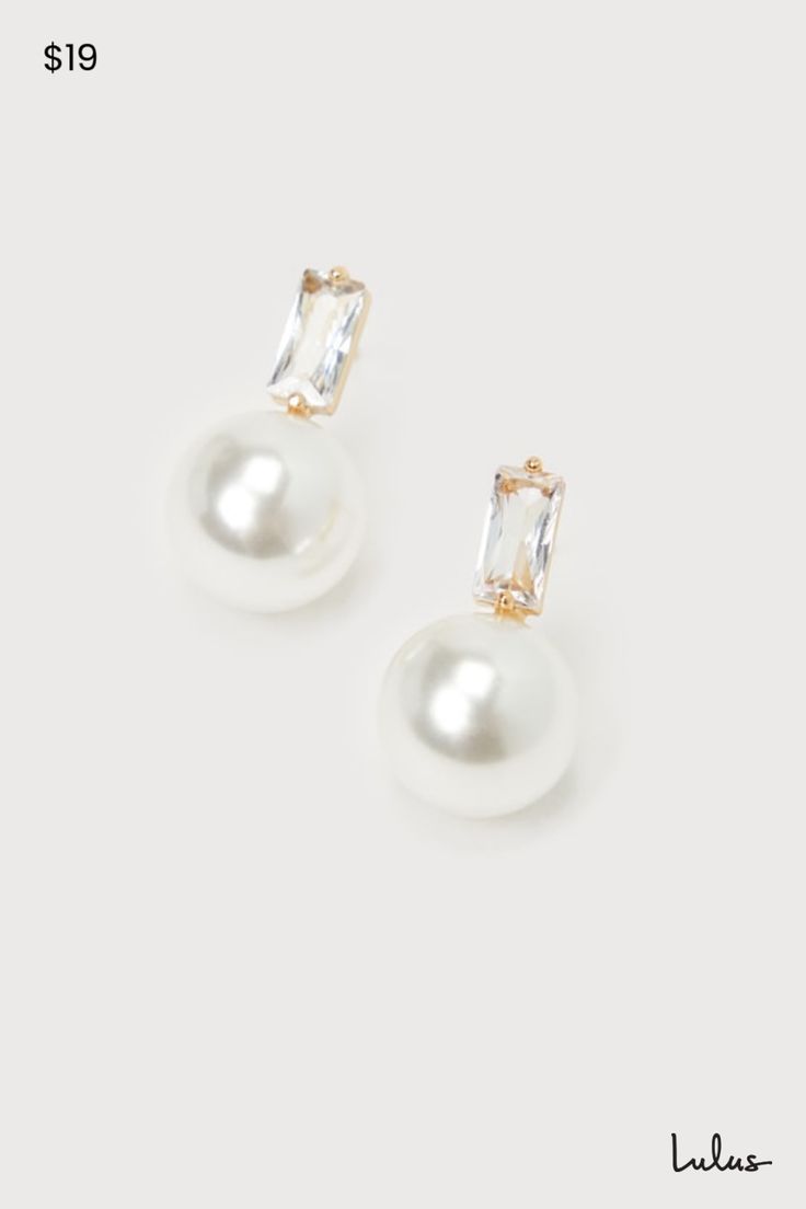 When you need to complete any special occasion look, the Lulus Elegant Passion White Pearl 14KT Gold Rhinestone Stud Earrings are the most stunning way to do so! These sophisticated earrings start with baguette-shaped rhinestone posts (with 14KT gold-plated settings) that support a gleaming, oversized faux pearl charm that completes the poised look. Make sure to wear an updo so you can show off these perfect beauties! This item is plated with real 14KT gold. Love it and it will love you back! Remove before exercising or showering, and when applying scents, lotions and sprays. Post backs. 0. 75" Long. 14K Gold Dipped Brass 25%, Glass 15%, Plastic 60%. Imported. Lulus | Elegant Passion White Pearl 14KT Gold Rhinestone Stud Earrings. Pearl And Diamond Drop Earrings, Sophisticated Earrings, Pearl Drop Earrings Bridal, Bridal Jewellery Earrings, Bridesmaid Earrings Gold, Bridal Earrings Drop, Pearl Earrings Wedding, White Pearl Earring, Bridal Earrings Pearl