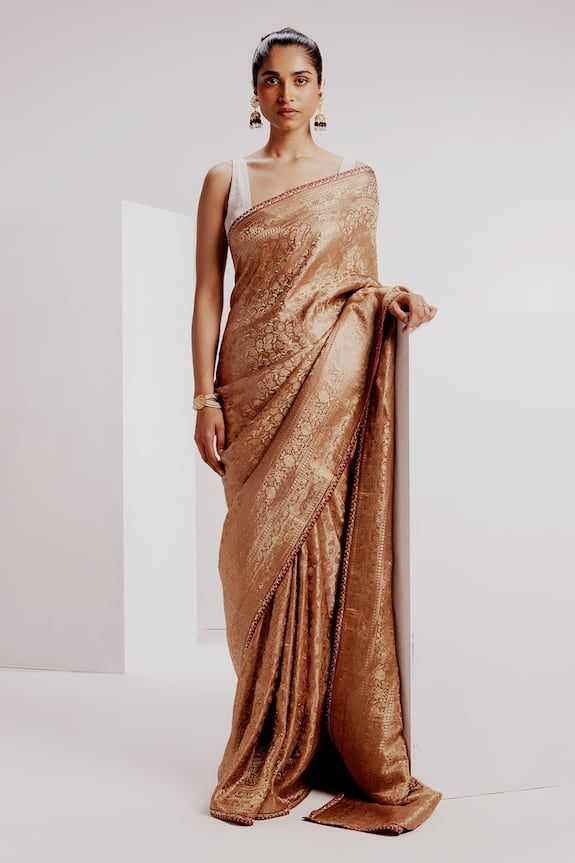 Beige banarasi saree featuring woven floral jaal motifs with tusser silk embroidered border. Comes with woven stripe blouse and petticoat. - Aza Fashions Brocade Pre-draped Saree With Resham Embroidery, Wedding Pre-draped Saree With Zari Weaving, Wedding Tissue Silk Pre-draped Saree With Self Design, Gold Brocade Pre-draped Saree With Zari Weaving, Festive Brocade Pre-draped Saree With Zari Work, Brocade Pre-draped Saree With Zari Work, Gold Tussar Silk Pre-draped Saree For Reception, Gold Brocade Pre-draped Saree With Zari Work, Elegant Fitted Banarasi Silk Pre-draped Saree