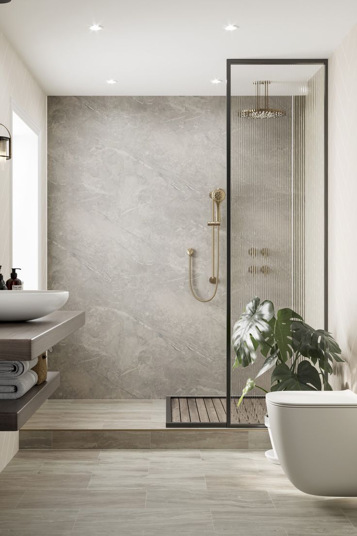 a bathroom with a bathtub, sink and shower head in it's corner