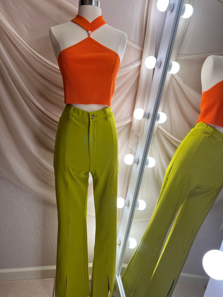 Yellow Green Pants - Front leg slits High Waisted - Kick flare Model in Small 26" Waist 5'1 INSEAM 32" SMALL 25" WAIST MEDIUM 27" WAIST LARGE 29" WAIST 92% Polyester 8% Spandex Green Fitted Wide Leg Bottoms, Fitted Green Wide Leg Bottoms, Fitted Wide Leg Green Bottoms, Green Stretch Wide Leg Pants, Retro Wide Leg Solid Bottoms, Green Stretch High Waist Wide Leg Pants, Trendy Stretch Full-length Dress Pants, Trendy Stretch Full Length Dress Pants, Green High Waist Stretch Wide Leg Pants