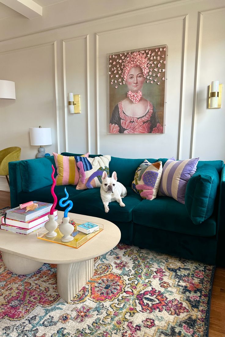 a living room filled with furniture and a painting on the wall