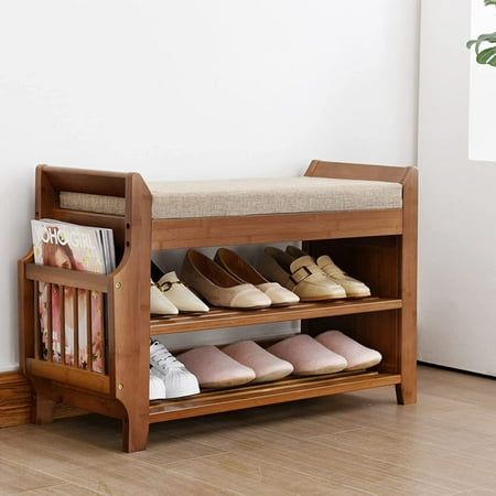 a wooden shoe rack with several pairs of shoes on it