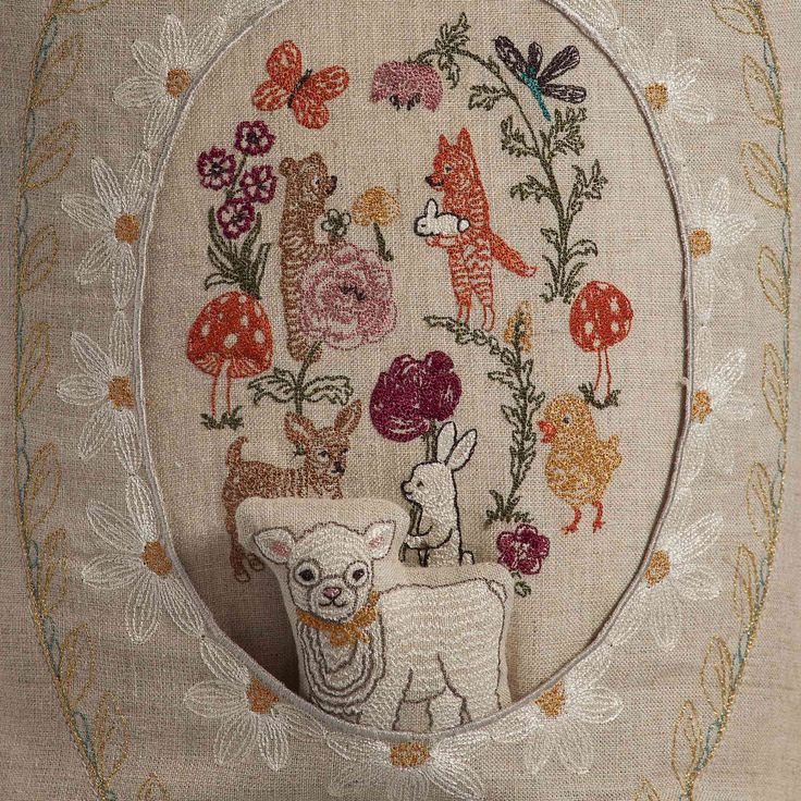 an embroidery pattern with animals and flowers on it