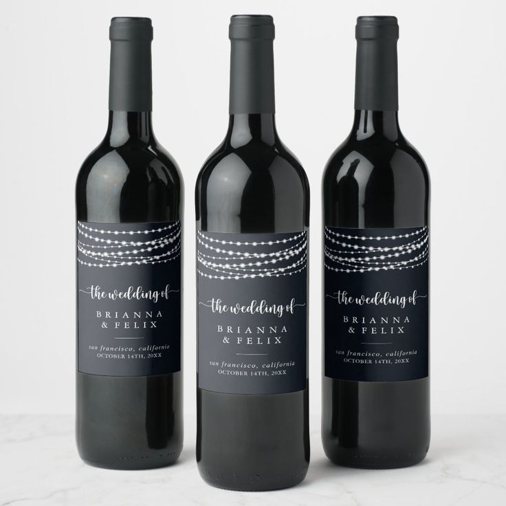 three bottles of red wine sitting next to each other