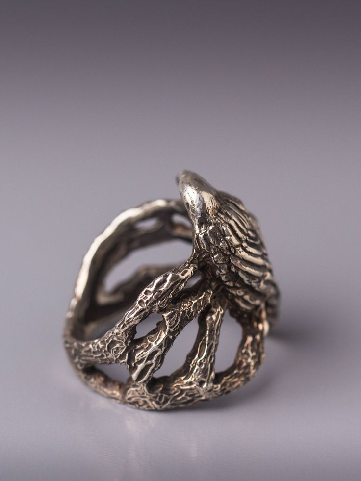 "Crow in the woodland silver ring. Crow as a totem animal is the keeper of sacred law, can see beyond illusion of the physical world and can \"shape shift\". As a guide crow teaches personal integrity, to speak your truth, walk your talk and be truthful to yourself. In creating this ring I was inspired by the mysterious nature of crow that seem to know more than what is on the surface. In the design of the ring I placed the crow on tree twigs and branches, inspecting and watching. Even though th Crow Ring, Raven Ring, Silver Bird Ring, Raven Jewelry, Witch Rings, Totem Animal, Personal Integrity, Woodland Jewelry, Bird Rings