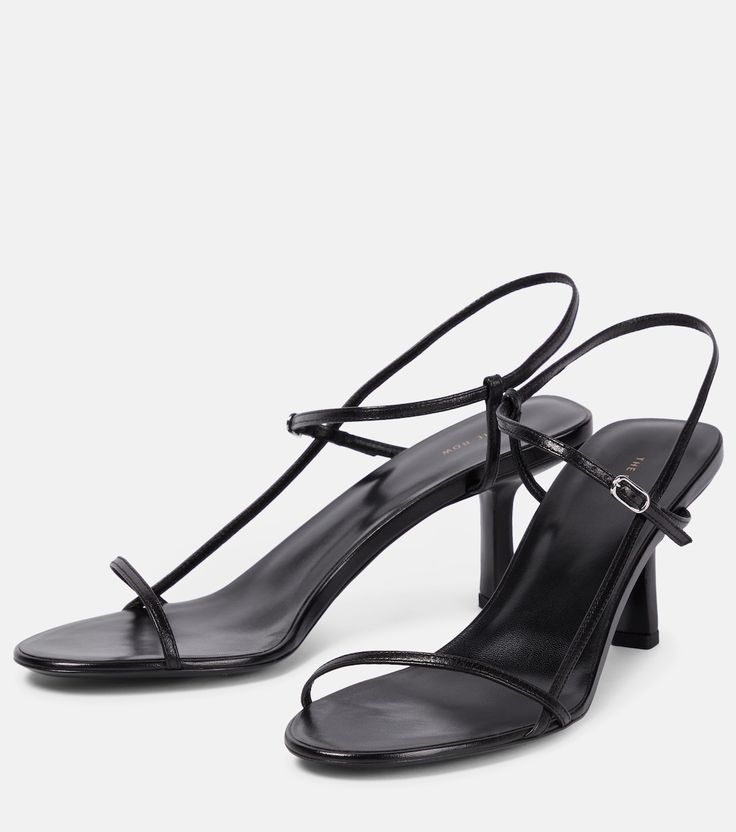 Bare leather sandals in black - The Row | Mytheresa Sleek Slingback Sandals With Sculpted Heel, Sleek Formal Slingback Sandals With Heel Loop, Sleek Evening Slingback Sandals With Heel Loop, Sleek Single Strap Heels, Sleek Strappy Slingback Sandals For Evening, Sleek Evening Slingback Sandals With Ankle Strap, Classic Strappy Evening Heels, Sleek Sandals With Heel Strap For Night Out, Sleek Heel Strap Sandals For Night Out