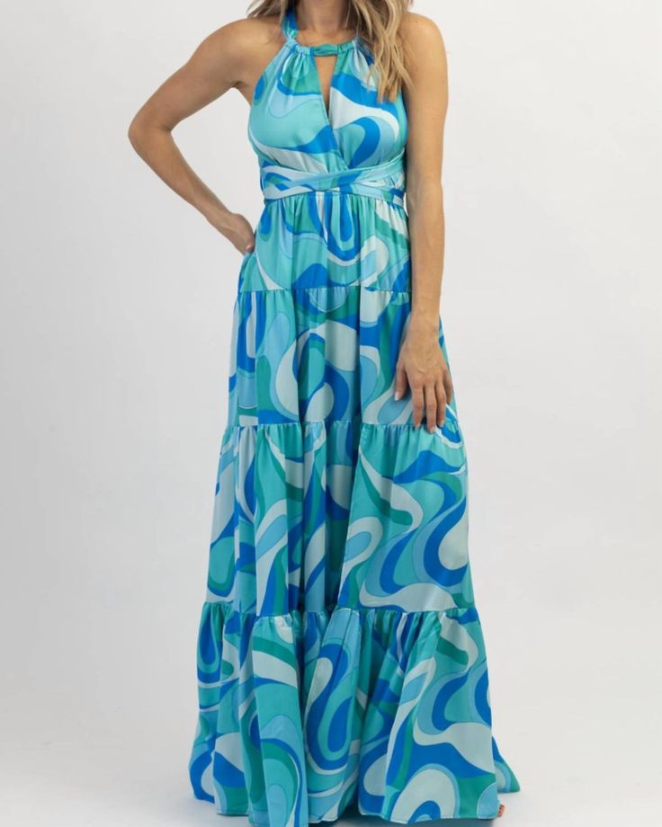 A maxi dress that is just as cute as it is comfortable. Halterneck, multi-blue, patterned throughout, self-tie detailing, maxi length, tiered. 100% polyester. The model is wearing a size small. Height 5'8, Dress size 2. A must-have! Round out your vacation and weekend wardrobe with this plus size dress Aakaa Paradiso Halter Maxi Dress In Multiblue | Multiblue | Dresses | Materials & Care Instructions: ['100% Polyester', 'Imported'] Turquoise Maxi Dress For Vacation, Chic Multicolor Tiered Maxi Dress, Blue Floral Print Tiered Dress, Blue Tiered Skirt Maxi Dress For Spring, Blue Printed Sundress Maxi Dress, Blue Flowy Tiered Skirt Dress, Blue Flowy Dresses With Tiered Skirt, Blue Flowy Dress With Tiered Skirt, Casual Blue Tiered Beach Dress