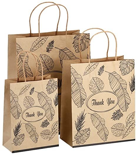 three brown bags with leaves on them and the words thank you written in black ink