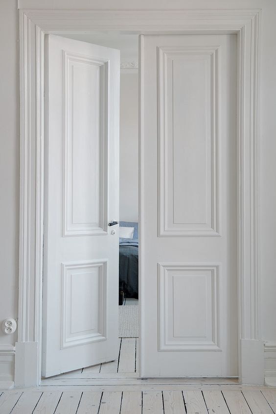 an open white door in a room