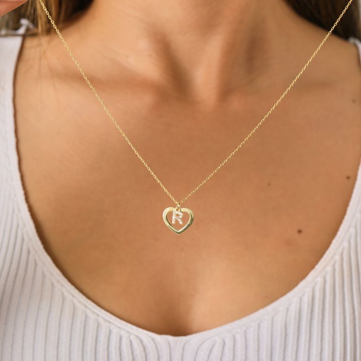 Introducing our enchanting Personalized Initial Heart Necklace 💖✨ Embrace the beauty of individuality with our exquisite Personalized Initial Heart Necklace - a perfect blend of elegance and personal touch! 💖 Cherished Customization: Make a statement with this heartwarming necklace by adding your or a loved one's initial. This personalized touch transforms the piece into a unique and meaningful accessory that captures the essence of your identity or a special connection. ✨ Timeless Elegance: Crafted with precision and attention to detail, the delicate heart pendant exudes timeless elegance. The dainty design makes it a versatile accessory that seamlessly transitions from day to night, adding a touch of sophistication to any outfit. 💖 Quality Craftsmanship: Our artisans meticulously crea Personalized Sterling Silver Heart Necklace, Sterling Silver Heart Necklace With Initial Pendant, Sterling Silver Heart Charm Necklaces With Initials, Sterling Silver Open Heart Birthstone Necklace, Open Heart Birthstone Charm Necklace, Personalized Open Heart Jewelry With Initials, Sterling Silver Heart Initial Pendant For Mother's Day, Heart-shaped Initials Jewelry For Personalized Gift, Valentine's Day Sterling Silver Heart Necklace With Initial Pendant