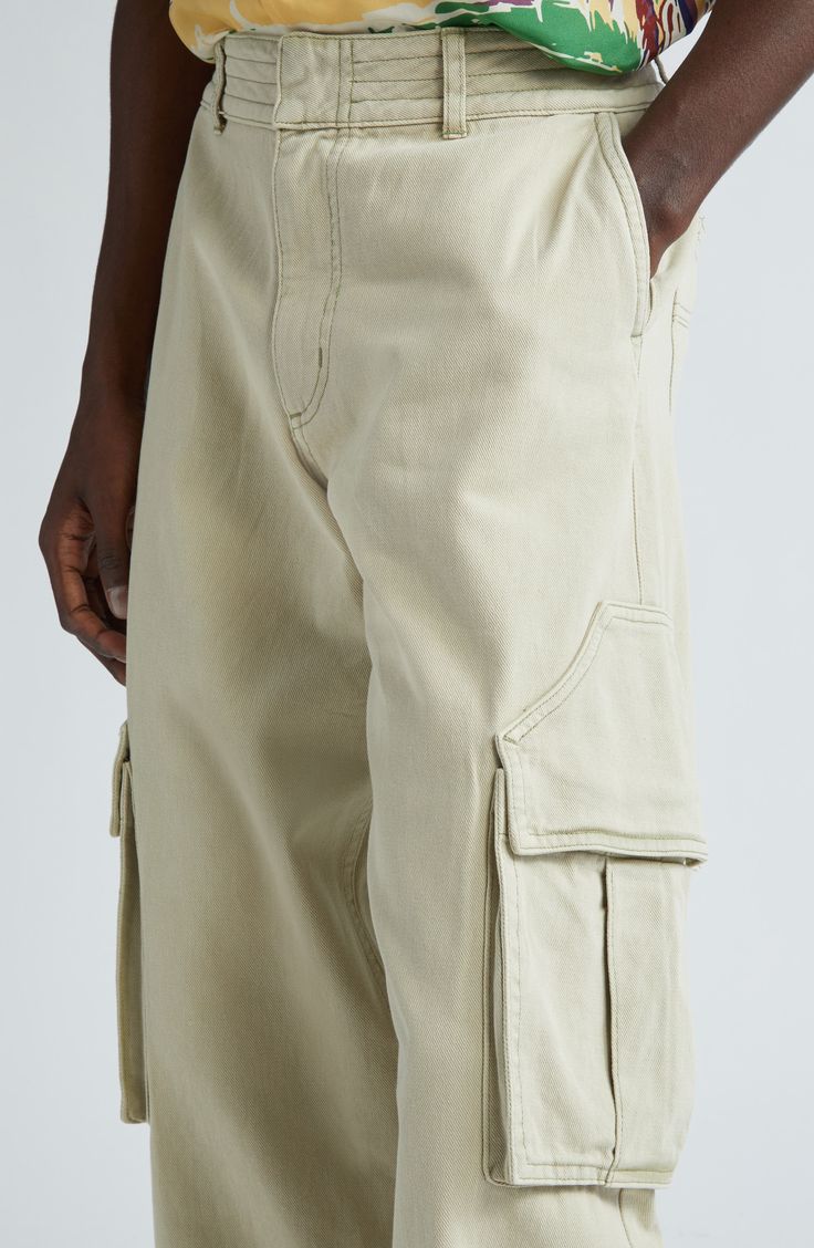 Rhuigi Villaseñor continues to elevate traditional streetwear with all-cotton cargo pants refreshed in the baggy fit seen all over the 2024 runways. Uniquely shaped pocket flaps further the statement-making aesthetic. Zip fly with hook-and-bar closure Front slant pockets; back patch pockets; cargo bellows pockets Lined 100% cotton Dry clean Made in the USA Designer Clothing Khaki Cotton Cargo Jeans With Pockets, Khaki Cotton Cargo Pants With Cargo Pockets, Tapered Leg Cotton Cargo Jeans, Khaki Cotton Cargo Pants With Pockets, Baggy Khaki Cotton Cargo Jeans, Streetwear Bottoms With Patch Pockets And Tapered Leg, Beige Straight Leg Cargo Jeans For Streetwear, Urban Cotton Cargo Pants With Side Pockets, Utility Cotton Cargo Pants With Hip Pockets