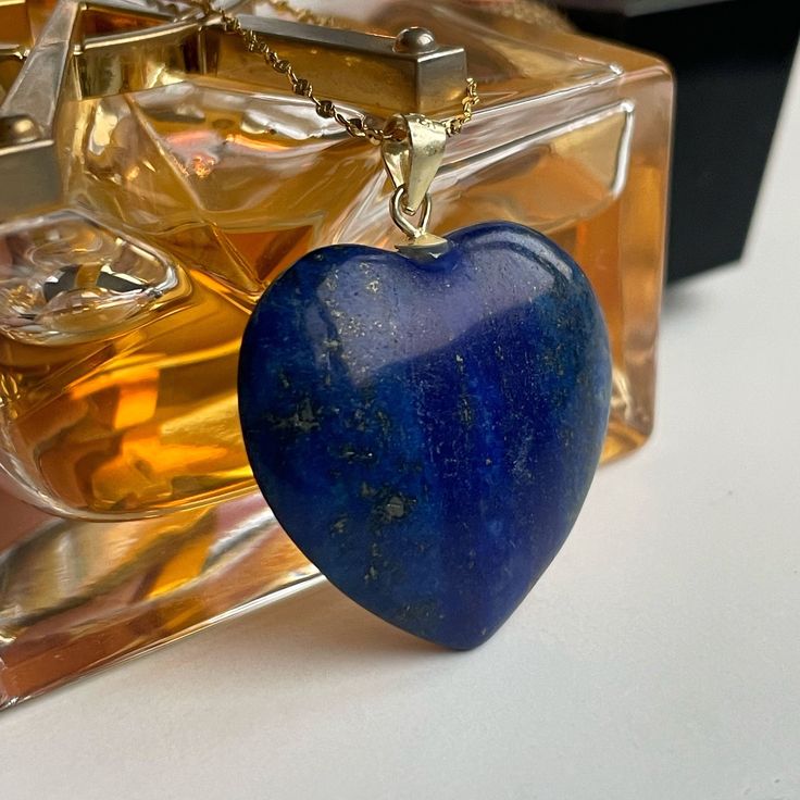 Luxury Lapis Lazuli Heart pendant featuring 18k gold filled 'star' chain over stainless steel. (doesn't change color). A deep blue stone from Afghanistan. This stone has the powers to heal and build any relationship! Comes in branded gift box and postcards. A great gift for those who want to show some attention and love to the recipient. 🌀The benefits of wearing LAPIS LAZULI jewelry: ➜ Lapis Lazuli stones are believed to help bring about harmony in relationships. ➜This is also a stone of sincer Stainless Steel Pendant Jewelry For Mother's Day, Sapphire Heart Pendant With Heart Charm, Sapphire Heart Pendant Birthstone Jewelry, Sapphire Heart Pendant For Anniversary, Anniversary Sapphire Jewelry With Heart Charm, Stainless Steel Pendant Jewelry For Anniversary, Tarnish Resistant Heart Pendant Necklace For Her, Tarnish Resistant Pendant Jewelry For Mother's Day, Heart Pendant Gemstone Jewelry Gift For Her