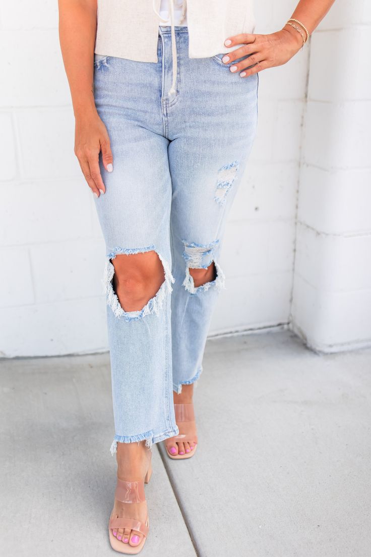 Ditch your worn-out jeans and upgrade to The Jodie 90's Dad Jeans. Made with super stretchy, buttery soft denim and stylish distressing, these are the best jeans you'll ever wear. Say goodbye to uncomfortable, and hello to ultimate comfort and style! Sizing: Elisha is 5'5" and is wearing a size 25 and Ash is 5'4" and is wearing a size 26 Fit: Super stretchy; We recommend to size down one for a fitted look Brand: Vervet by Flying Monkey Color: Light Wash Rise: 11" (Super High Rise) Inseam: 28.5" Distressed Dad Jeans Comfort Stretch Denim Material: 94.2% Cotton | 4.7% Polyester | 1.1% Spandex Care Instructions: Machine Wash Styled with: Beautiful soul linen vest, Kimmy square neck tank, alma shoulder tank, Nickel And Suede, Summer Neutrals, Linen Vest, Dad Jeans, Concert Looks, Denim Joggers, Flying Monkey, Midi Dress Party, Denim Material