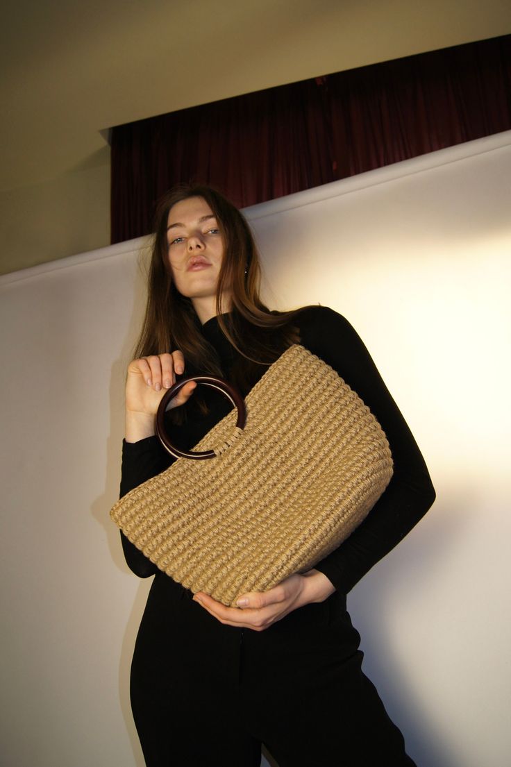 This eco-bag is made of natural jute. Wooden handles. Handmade. Weight 1 kg. dimensions: width at the top 41cm, at the bottom 29 cm, height 26cm (without handles). Cotton lining. Luxury Everyday Jute Shoulder Bag, Beige Natural Fiber Bag With Round Handle, Eco-friendly Jute Bag With Double Handle, Natural Straw Bag With Round Handle For Shopping, Natural Straw Bag With Rolled Round Handles, Natural Color Straw Bag With Round Handle For Shopping, Neutral Straw Bag With Braided Handles For Shopping, Jute Shoulder Bag With Braided Round Handles, Jute Straw Bag With Round Handle