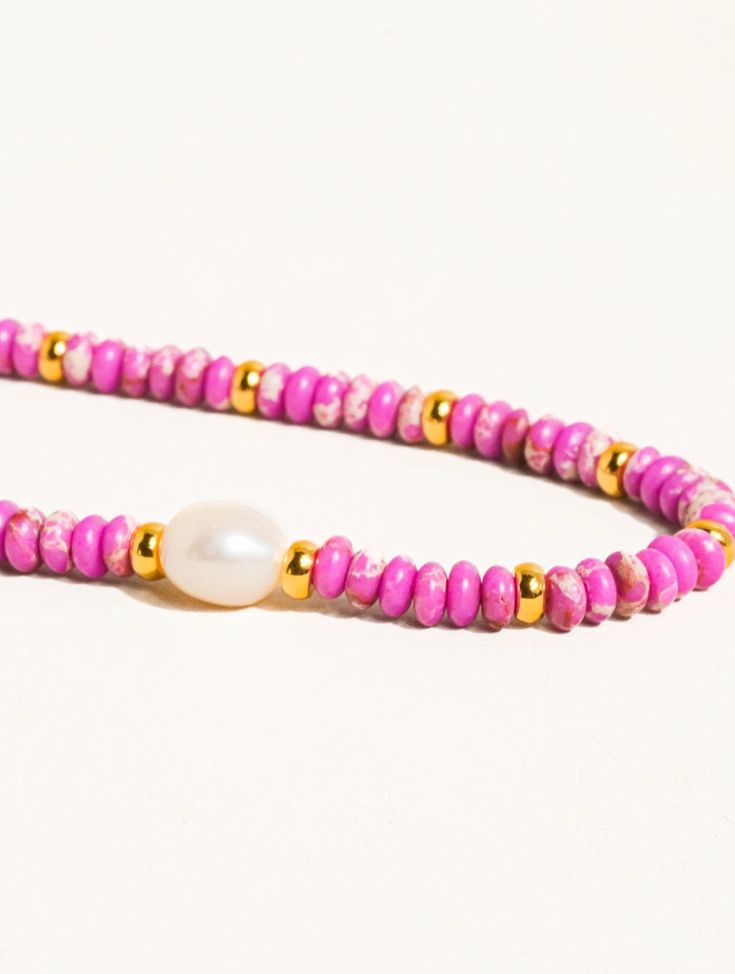 Millie Purple Boho Handmade Beaded Pearl Necklace Boho Handmade Beaded Pearl Necklace 18K Gold Plating Colored Stone Freshwater Pearl Chain Length: 15 inches Extension Length: 2 inches Adjustable Rondelle Beaded Necklaces As Gifts, Heishi Bead Bracelet With Beaded Chain, Heishi Beaded Chain Bracelet Jewelry, Pink Spacer Beaded Necklace For Festivals, Pink Spacer Beads Necklace For Festival, Pink Spacer Bead Necklaces For Festivals, Adjustable Rondelle Necklaces With Colorful Beads, Gold Hand-strung Heishi Beads Necklace, Hand-strung Round Beads Choker As Gift