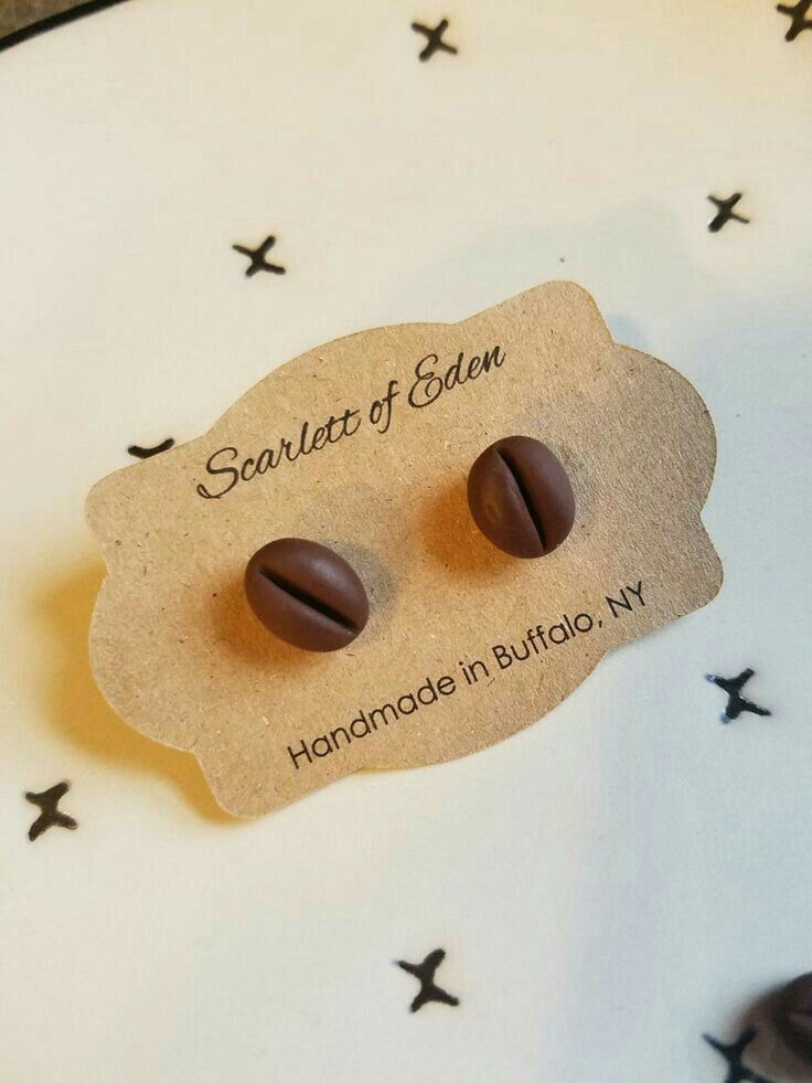 two chocolates are sitting on top of a card