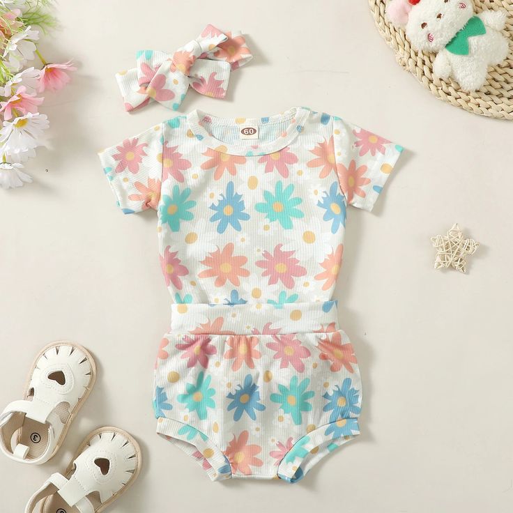 This adorable baby girl outfit features vibrant floral prints and comes with a matching romper shorts and headband. Perfect for playdates, picnics, or any outdoor adventure. Your little one will stay stylish and comfortable all season long! Romper Shorts, Baby Girl Outfit, Flowers Summer, Adorable Baby, Short Rompers, Outdoor Adventure, Summer Outfit, Little One