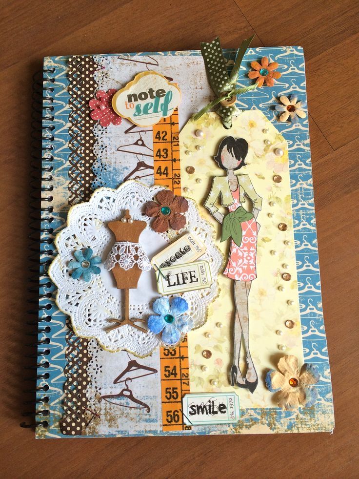 an altered book with paper and doily on the cover, featuring a woman in a dress