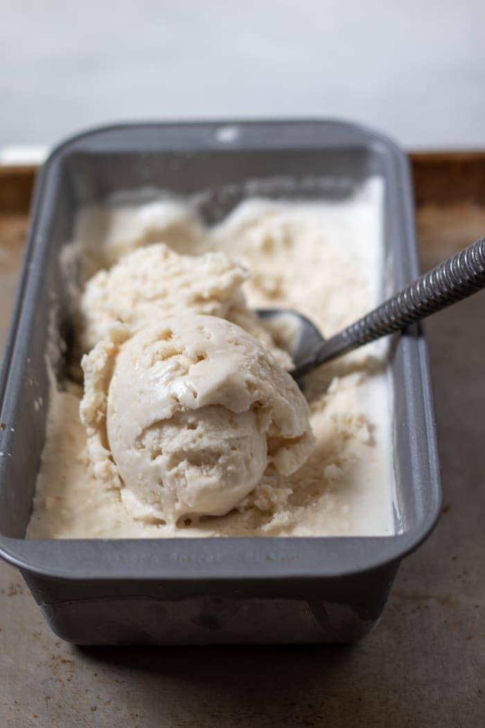 a scoop of ice cream in a metal container