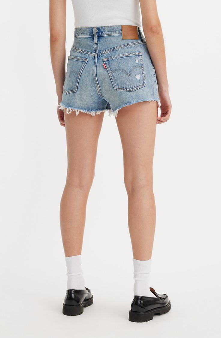 Distressed for the best, these high-rise cutoffs are made with nonstretch denim and the iconic 501 silhouette that's a must for warm weather. 2" inseam; 25" leg opening; 11" front rise; 16" back rise (size 29) Button fly Five-pocket style 100% cotton Machine wash, tumble dry Imported Denim Shorts Outfits, Cheap High-waist Levi's Jean Shorts, Levi’s Denim Shorts, Romanticizing Summer, Levi's Distressed Mid-rise Jean Shorts, Levi’s Cutoffs, Demin Shorts, Levi's Denim Blue Cutoff Shorts, 501 Shorts