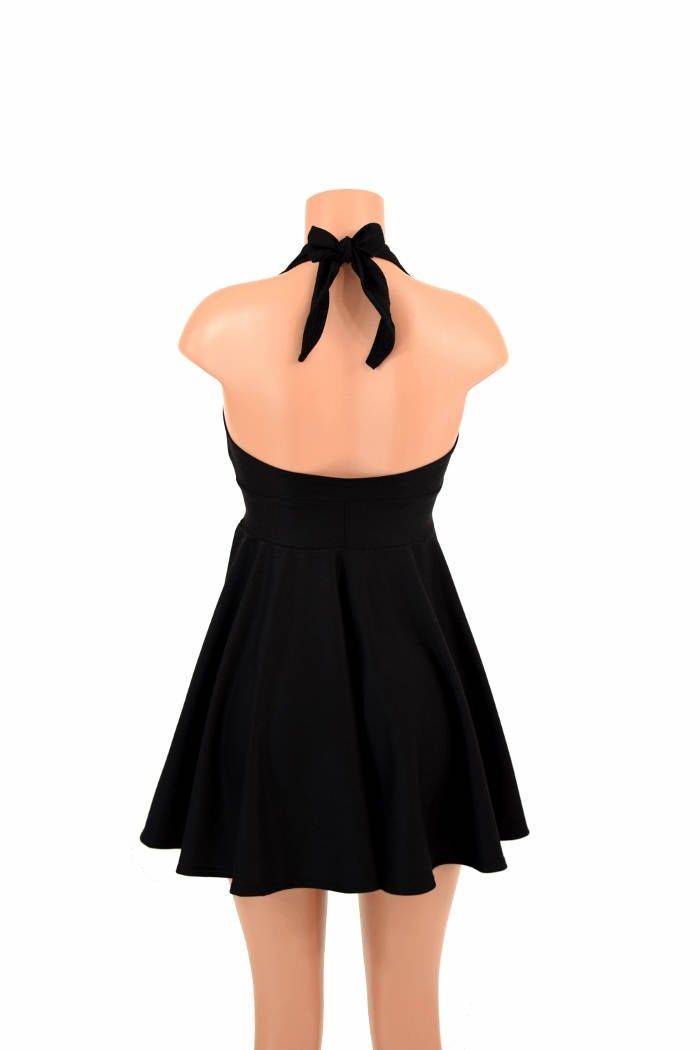 "This item is made to order, please read all the way through the listing before purchasing! This flowy dress is made of super comfy black soft knit stretch fabric. The halter top is darted and ties behind the neck, the hemline is circle cut. Length: 17\" measured from the waist to the hemline. We can create this dress from any other fabric in our shop, just ask! Womens Sizing (See below for instructions on where measurements should be taken) XXS: Bust 29\"-30\" / Waist 22\"-23\" / Hips 30\"-32\" Black Stretch High Neck Halter Dress, Black Stretch Halter Dress With High Neck, Black Fitted High Neck Halter Dress, Black Fitted Halter Dress With High Neck, Flirty Black Halter Neck Dress, Black Mini Length Halter Top For Party, Black Mini Halter Top For Parties, Black Stretch Halter Dress Backless, Black Stretch Halter Backless Dress